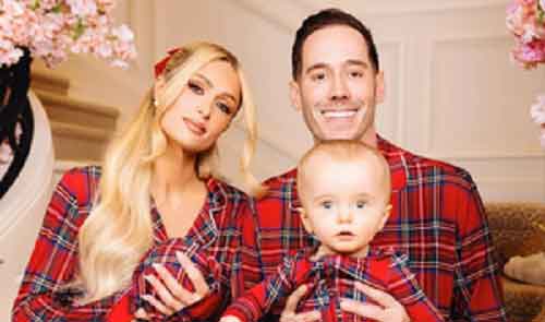Paris Hilton poses with her babies, husband in matching pyjamas in family Christmas pictures