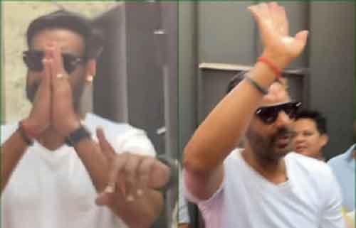 Ajay Devgn greets fans with a namaste outside his residence in Mumbai on 55th b’day