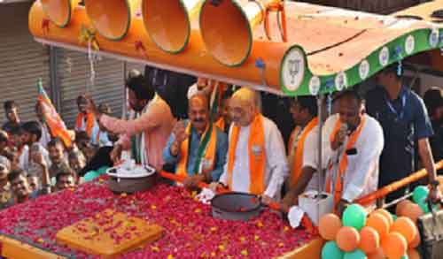 HM Amit Shah holds massive roadshow in Karnataka’s Haveri