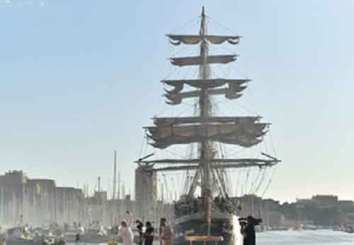Olympic flame lands at Marseille Old Port amid fiery atmosphere