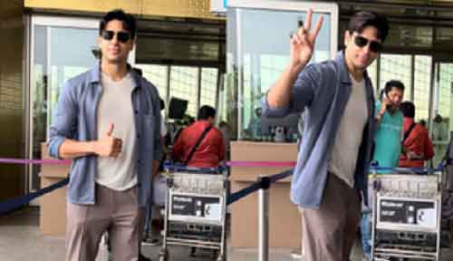 Sidharth Malhotra en route to Delhi to cast his vote, shows victory sign to paparazzi