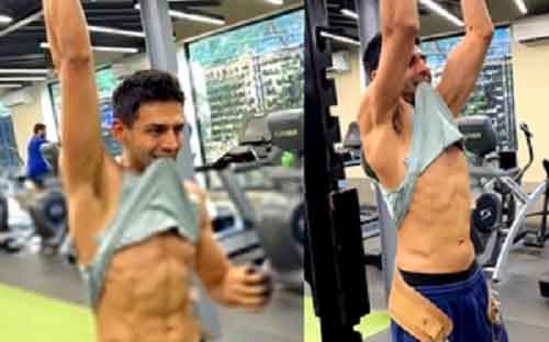 Kartik Aaryan flaunts his washboard abs as he does ‘weight-lifted pull ups’