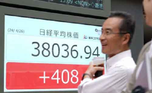 Tokyo stocks end lower amid profit taking, automaker scandal