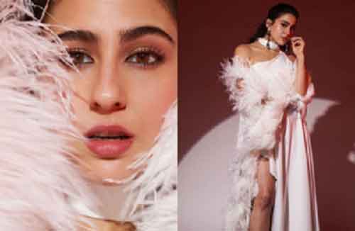 Sara Ali Khan dazzles in white thigh-high slit gown with feather sleeves, dewy makeup