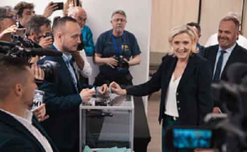 French parliamentary polls close with high turnout, exit poll indicates far-right tops vote share
