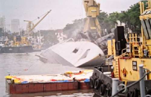 Indian Navy frigate Brahmaputra fully tilts onto one side after onboard fire at Mumbai dockyard