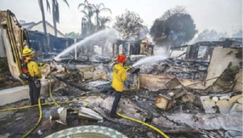 Fast-growing wildfire destroys homes in California