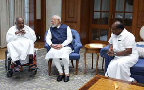 Former PM Deve Gowda, Kumaraswamy meet PM Modi
